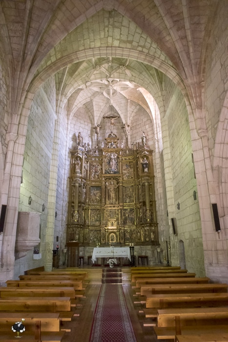 The inside of San Martin with pews and alterpiece